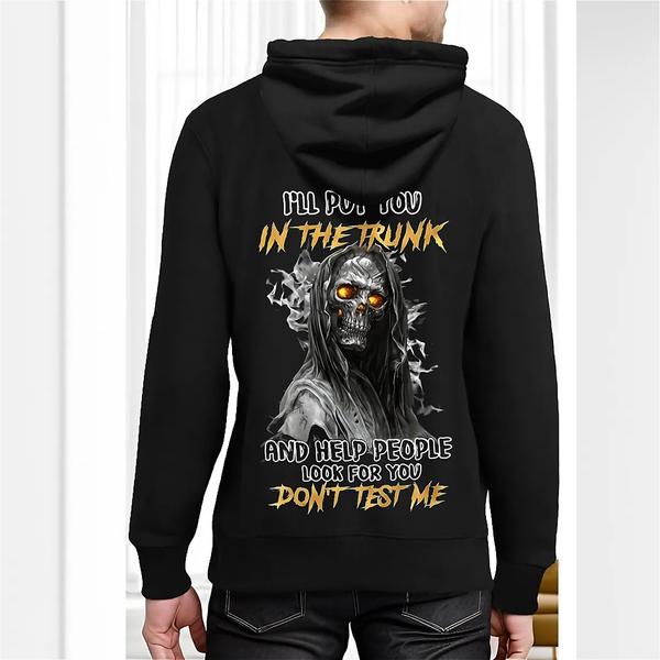 Back view of black hoodie featuring a hooded skeleton with glowing orange eyes and bold yellow and white text reading “I’ll put you in the trunk and help people look for you. Don’t test me.”