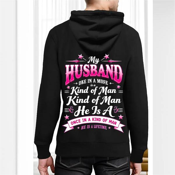 Back view of black hoodie with multicolor text reading “My Husband Is a Once-in-a-Lifetime Kind of Man” – sentimental statement design