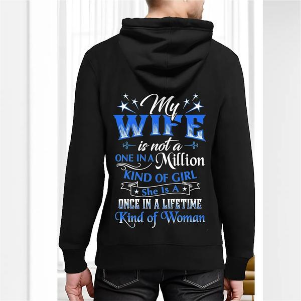Back view of black hoodie featuring decorative white and blue text reading “My wife is not a one in a million kind of girl, she is a once in a lifetime kind of woman” with star graphics
