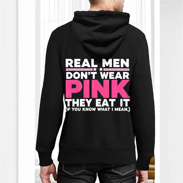 Back view of black hoodie featuring bold white and pink text reading “REAL MEN DON’T WEAR PINK THEY EAT IT (IF YOU KNOW WHAT I MEAN.)”