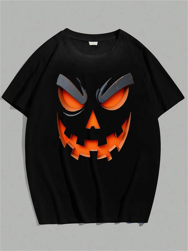 Black T-shirt with glowing orange jack-o'-lantern face featuring sinister eyes, jagged mouth, and arched brows