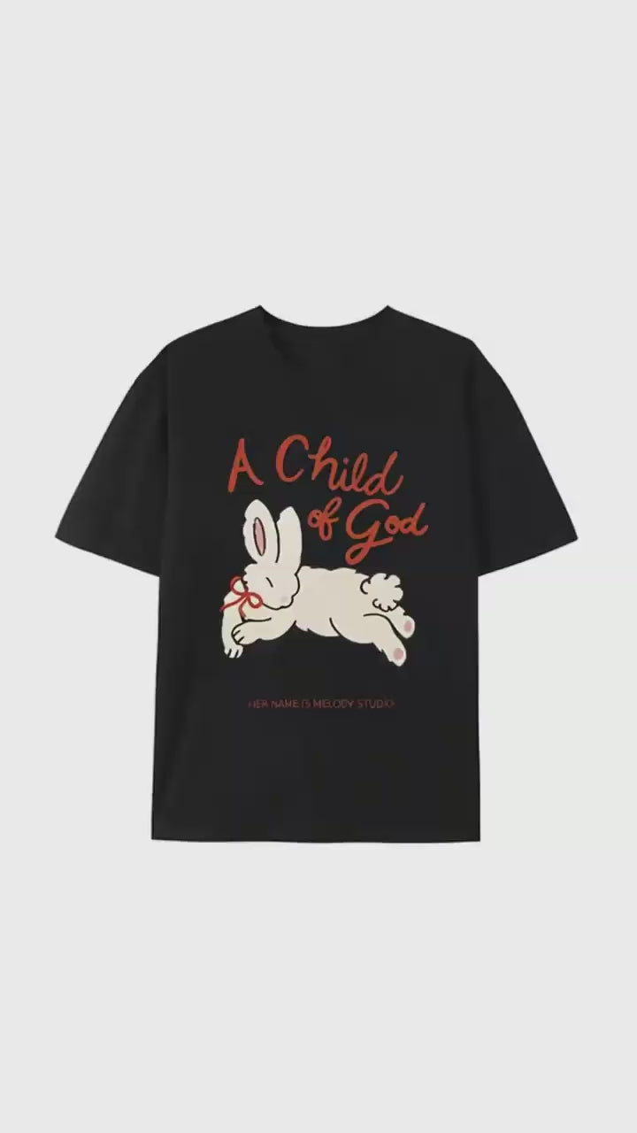Women's "A Child of God" Cute Rabbit Graphic Tee, Black Cotton T-Shirt, Faith-Based Inspirational Shirt, Minimalist Art Casual Apparel, HER NAME IS MELODY STUDIO Design Top